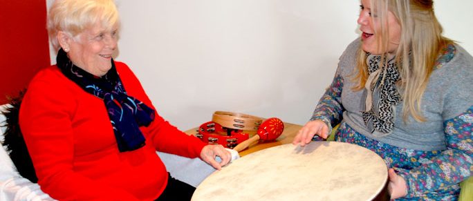 Music-therapist-elderly-drum-health-community-session